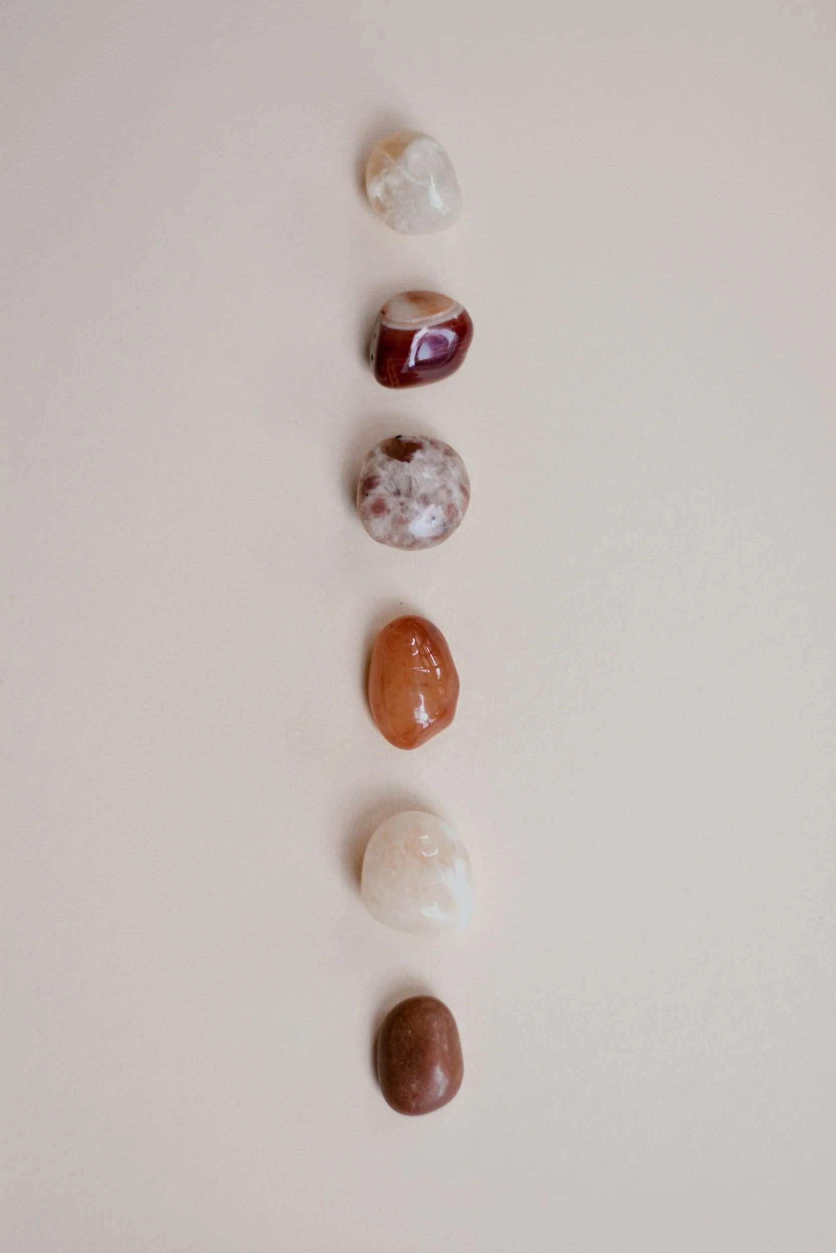 A column of polished stones in warm neutral tones